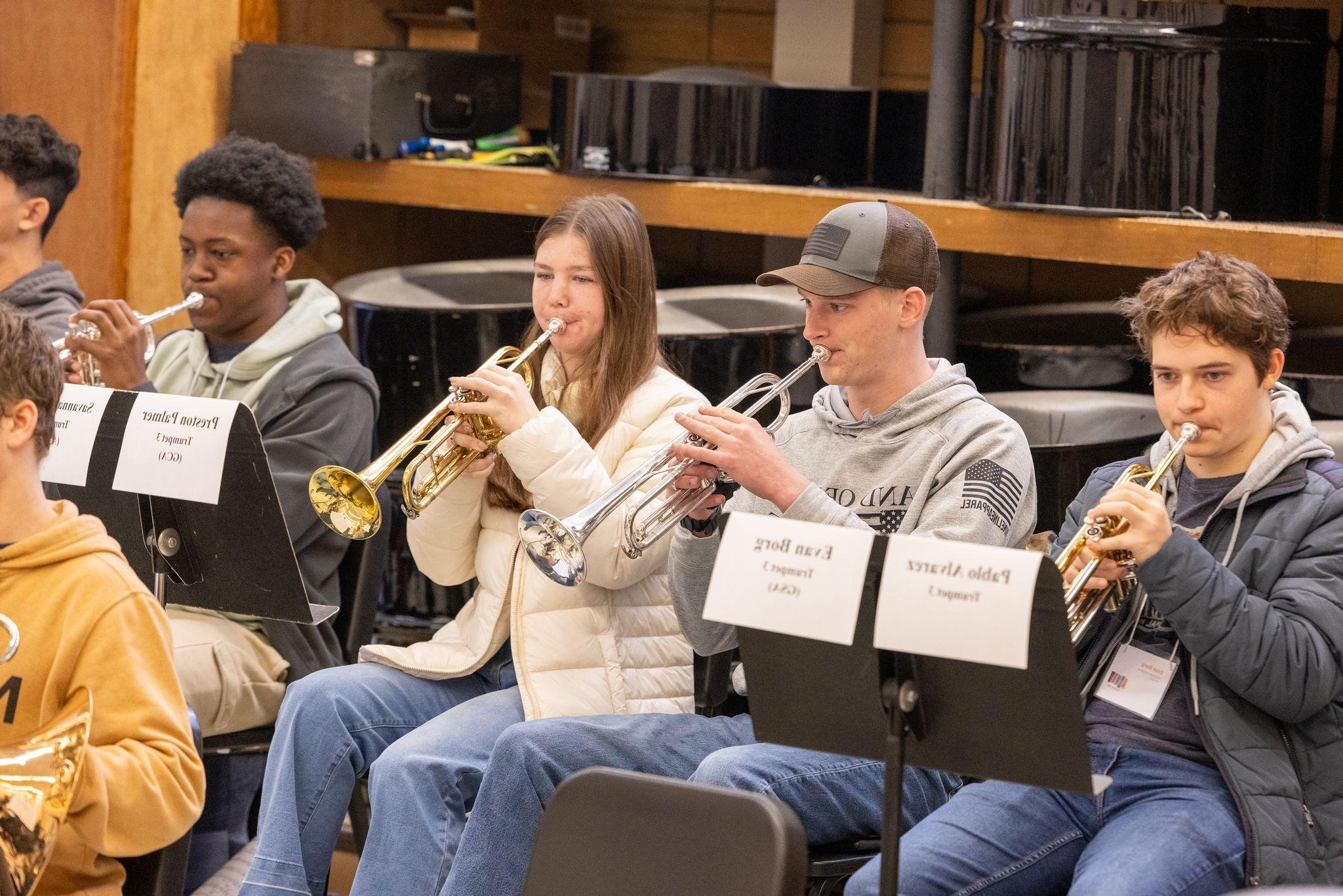 Students playing trumpet during practice